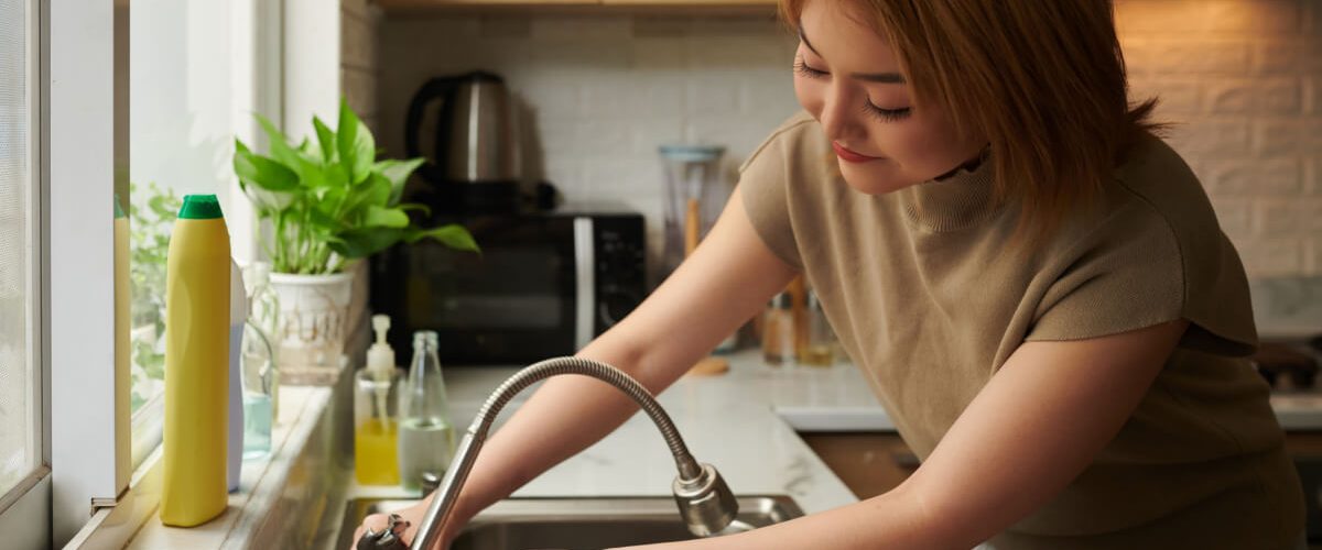 woman-fixing-leaking-tap-2022-06-07-12-43-31-utc.jpg
